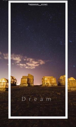 a picture of a desert under a starry sky at Aqua Sun in Nuweiba