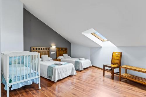 Ένα ή περισσότερα κρεβάτια σε δωμάτιο στο Apartamentos Turisticos As Cetareas