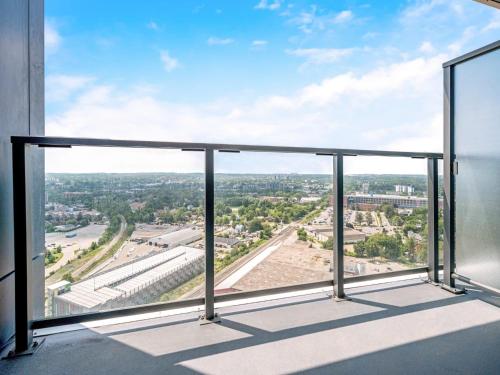 a balcony with a view of a city at Modern 1BR Condo - King bed - Cityscape Views in Kitchener