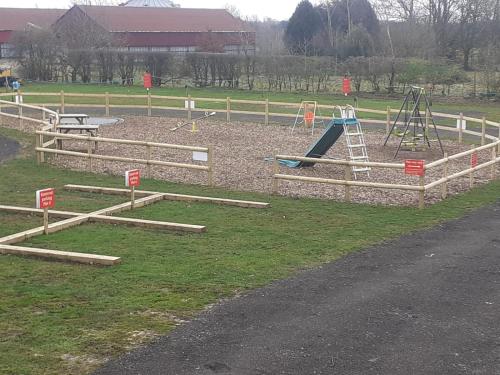 a park with a playground with a slide at Red Lion Holiday Home 1 in Lincolnshire