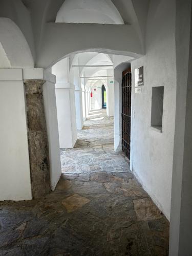 an empty hallway in an old building with a gate at Schloss Apartment Lankowitz in Maria Lankowitz