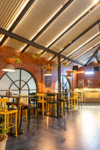 a restaurant with tables and chairs in a room at Shilton Dee Cee in Chennai