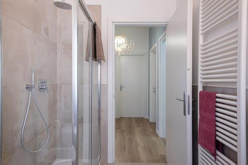a bathroom with a shower with a glass door at Apartment Chiara tra le Ville Lucchesi! in Capannori