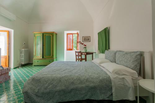 Postel nebo postele na pokoji v ubytování B&b 1787 in Montechiaro