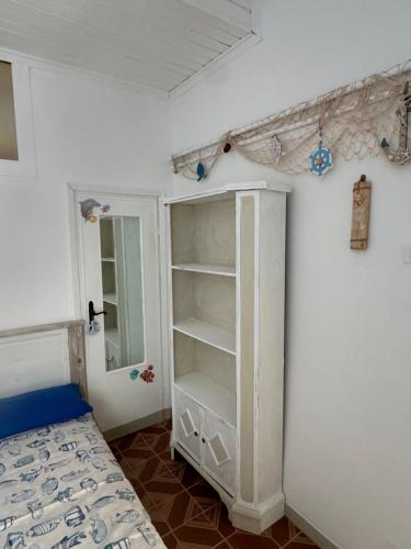 Postel nebo postele na pokoji v ubytování A due passi dal mare
