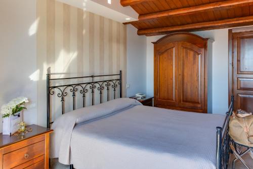 Un ou plusieurs lits dans un hébergement de l'établissement Hotel Aliai