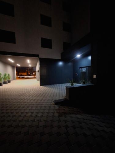 an empty building with a dark room with lights on at Bubi Apartments-Private parking in Zagreb