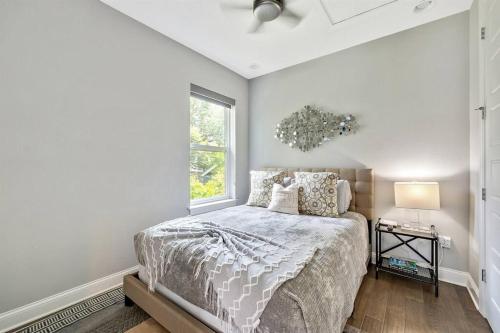 a bedroom with a bed and a window at Luxury Living Superior Home in Prime Tampa Location in Tampa
