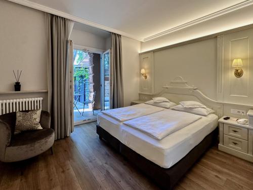 Postel nebo postele na pokoji v ubytování Windsor Merano Hotel & Suites