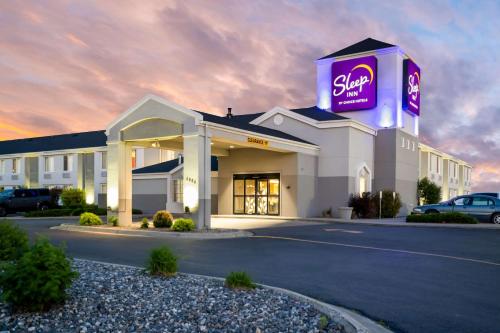 a slow gas station with a sign on top of it at Sleep Inn Billings in Billings