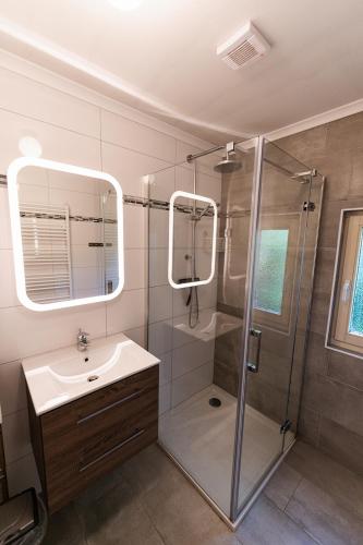 a bathroom with a shower and a sink at 't Eekhoornnest in Soest
