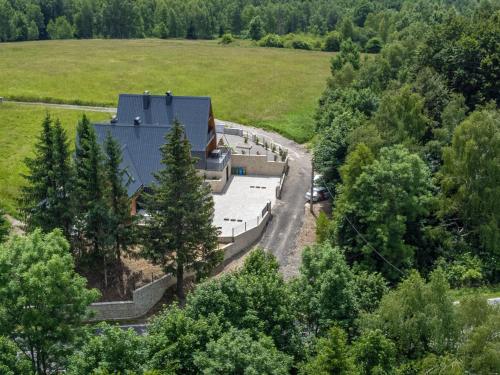 an aerial view of a building in a field at Holiday Home Vuk by Interhome in Kupjak