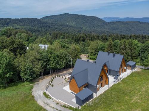 an aerial view of a house in the mountains at Holiday Home Vuk by Interhome in Kupjak
