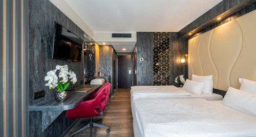 Cama o camas de una habitación en PLAZA Hotel Gelsenkirchen