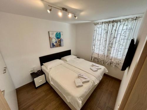 Кровать или кровати в номере Apartments Maraž
