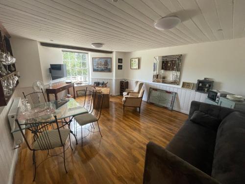 a living room with a couch and a table at Croft House Apartments in Hastings