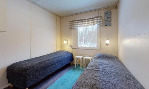 Giường trong phòng chung tại Kokkola Camping Meripuisto