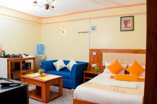 Giường trong phòng chung tại Shalom Apartments Naivasha Town