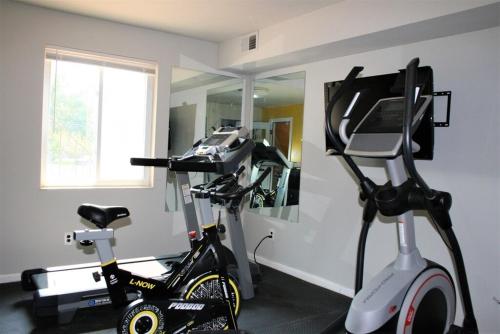 a room with a treadmill and an exercise bike at Spacious Retreat I Balcony I Parking I Chateau in Wilmington