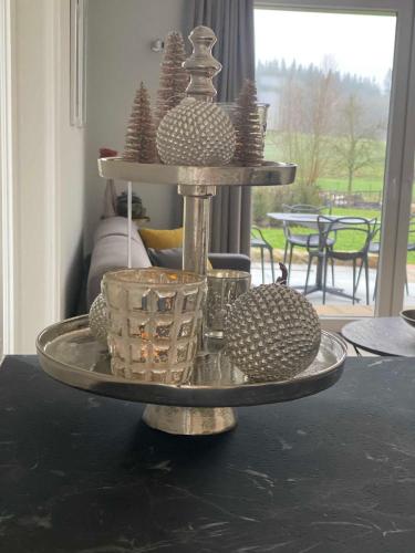 a silver tray with dishes on top of a table at DRIEHOF LifeStyle Suite Apt 1 in Tecklenburg