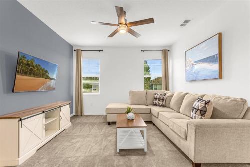 A seating area at Upstay Ultimate Orlando Retreat w Pool & Hot Tub Sleeps 16