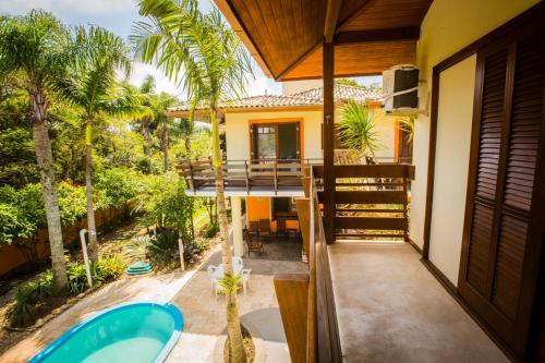 a view from the balcony of a house with a tub at Hospedagem Tulipane - Praia do Campeche in Florianópolis