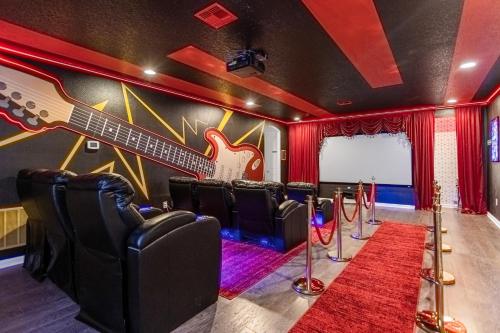 a music room with a guitar on the wall at Upstay Family Resort Mansion- Pool, Games, Theater in Kissimmee