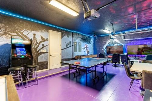 a ping pong room with a ping pong table at Upstay Family Resort Mansion- Pool, Games, Theater in Kissimmee