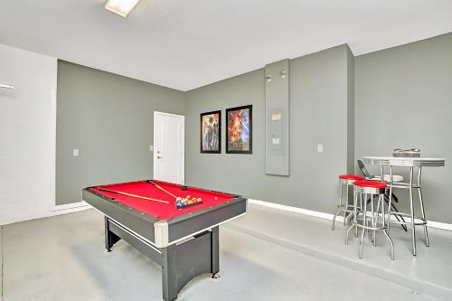 a ping pong table in a room with a pool table at Family Resort - 6BR Mansion - Private Pool, Home Theater, BBQ and More in Kissimmee