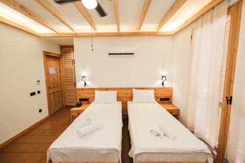 Ένα ή περισσότερα κρεβάτια σε δωμάτιο στο The Cadianda Inn