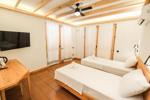 Ένα ή περισσότερα κρεβάτια σε δωμάτιο στο The Cadianda Inn