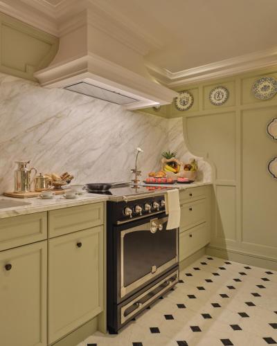a kitchen with a stove and a counter top at Airelles Château de la Messardière in Saint-Tropez