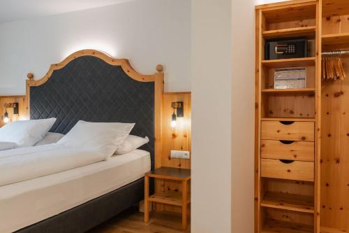Un ou plusieurs lits dans un hébergement de l'établissement Hotel Asterbel