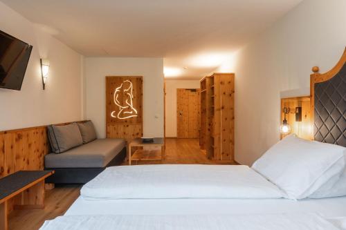 Un ou plusieurs lits dans un hébergement de l'établissement Hotel Asterbel