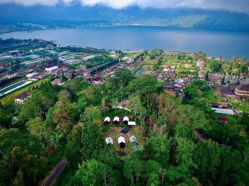 an aerial view of a town and a lake at Green Lava Lake View Glamping Bedugul By IHM in Bedugul
