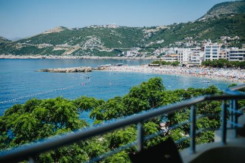 a view of a beach with a bunch of people at MonteCasa Seaview Rooms in Dobra Voda