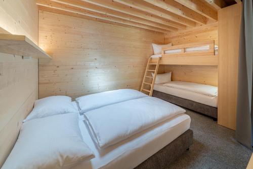 Ένα ή περισσότερα κρεβάτια σε δωμάτιο στο Apartment am Camping Dornbirn - 13 Breitenberg