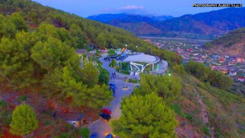 a person standing on top of a hill near a river at Hotel Panorama & Spa Elbasan in Elbasan