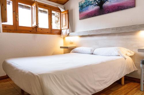 Posteľ alebo postele v izbe v ubytovaní Hostal Casa Palmira