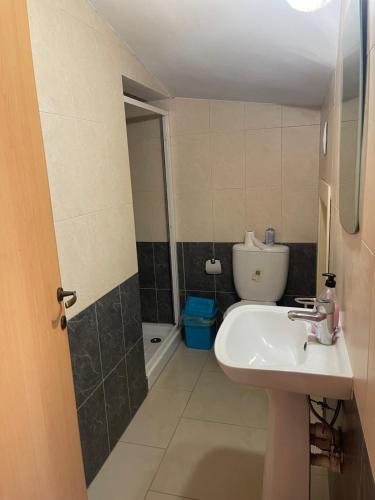 a bathroom with a sink and a toilet at Valentine Family Villa in Kiti