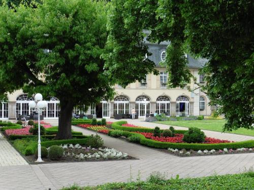 a large building with flowers in front of it at Ferienwohnungen Waldsicht und Dorfsicht in Winkel