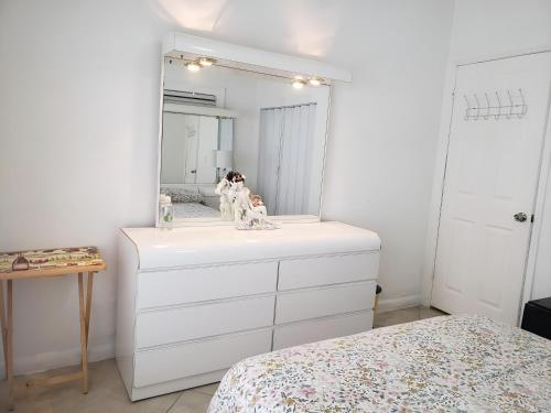 a bedroom with a white dresser with a mirror at B1 Best Value on Private Bedroom with Private Bathroom in Little Havana, Miami in Miami