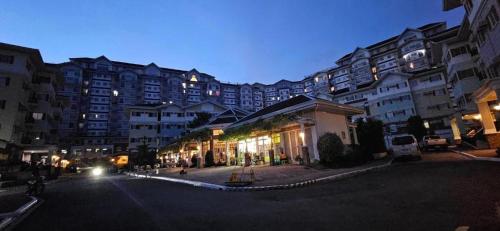 a city street with tall buildings at night at Apple One Banawa Heights Cebu City Cheap & High Quality in Cebu City