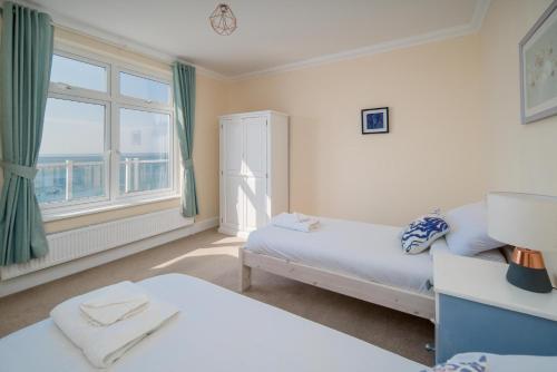Ένα ή περισσότερα κρεβάτια σε δωμάτιο στο The Penthouse