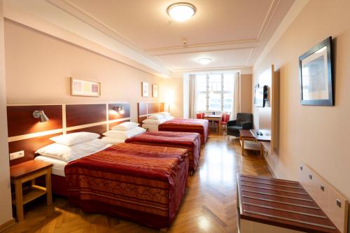 Postel nebo postele na pokoji v ubytování EA Hotel Julis