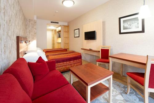 TV a/nebo společenská místnost v ubytování EA Hotel Julis