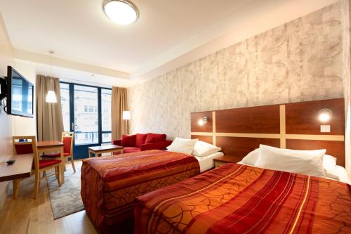 Postel nebo postele na pokoji v ubytování EA Hotel Julis