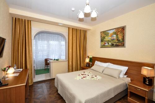 Кровать или кровати в номере Бутик-Отель Сургут
