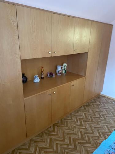 a kitchen with wooden cabinets and a floor at KochGaranas Ferienhaus in Garanas