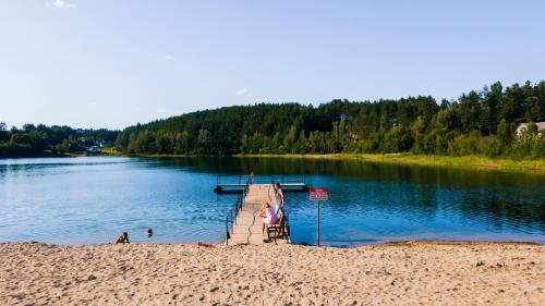 a dock in the middle of a lake at Agroturystyka na Kaszubach in Lipnica